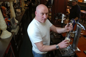 Peter Swanson behind his bar in Edinburgh